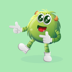 Cute green monster playful with pointed hand