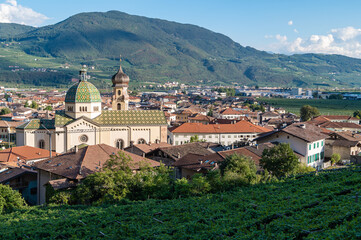 Obraz premium The dome and the bell tower of the Church of Saint Mary of the Assumption, Mezzocorona, Piana Rotaliana, Trentino-Alto Adige, Italy, 12th century.