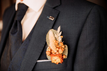 Beautiful dry flower for groom suit. Wedding brooch made of dry flowers