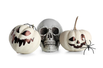 Halloween pumpkins with human skull and spiders on white background