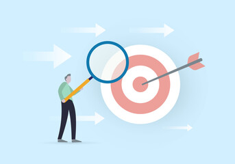 Business analysis to increase sale, marketing target audience research concept. Businessman holding magnifying glass analyzes the ultimate goal and directions of development to achieve it