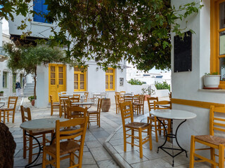 Greek outdoors tavern restaurant at Tinos island, Pyrgos village Cyclades Greece.