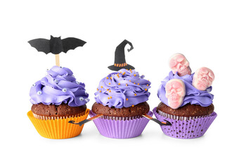 Tasty Halloween cupcakes with decor on white background