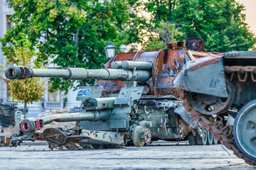 Fototapeta na wymiar Destroyed Russian military equipment on display in the center of Kyiv on Mikhailovskaya Square. War in Ukraine, tanks, armored personnel carriers