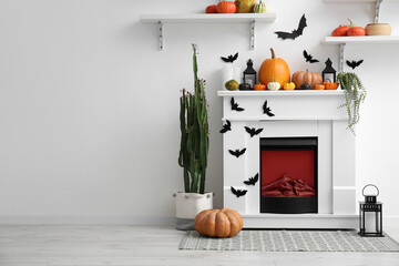 Interior of living room decorated for Halloween with fireplace and shelves