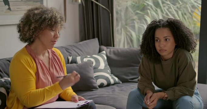 Angry African American women talking with her therapist about problems