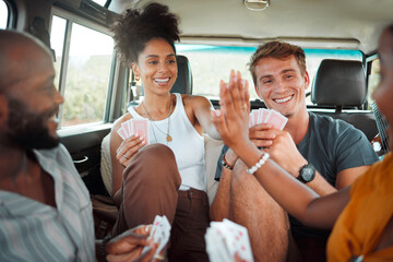 Card game, car and friends high five on a road trip enjoy holidays, vacation or fun weekend...