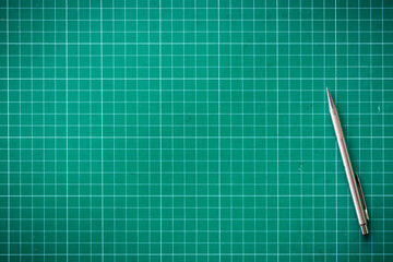 Plastic green cutting mat texture. squared sheet texture green background