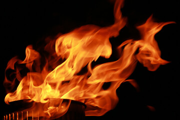 Abstract fire flames from torch, isolated on black background