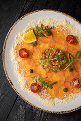 delicious salmon carpaccio on a plate