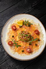delicious salmon carpaccio on a plate
