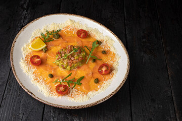 delicious salmon carpaccio on a plate