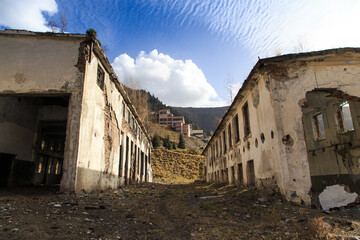 Old abandoned building. Ruins of a former factory. Dirty, dirty walls, large windows. View of...