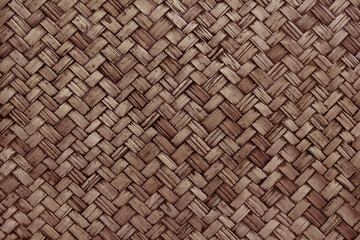 Old dark brown bamboo weave texture background, pattern of woven rattan mat in vintage style.