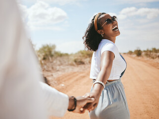 Happy, safari and couple love holding hands on a romantic honeymoon holiday vacation outdoors in summer. Romance, traveling and black woman with a big smile walking with partner on adventure in Texas