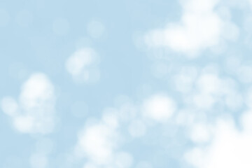 Abstract light blue blur bokeh for background, light blur on high light blue gradient abstract background in central design for presentation.