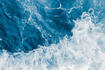 Fototapeta na wymiar Dark blue sea ocean wave and white foam
