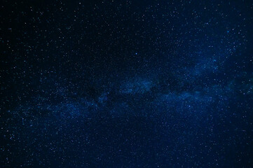 Stars on background of the night starry sky. Milky Way, galaxies and universes on a dark blue...