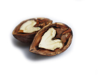 Two half walnut in shape of heart isolated on white background