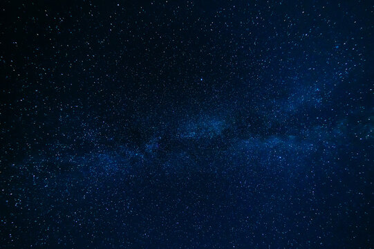 Stars on background of the night starry sky. Milky Way, galaxies and universes on a dark blue background