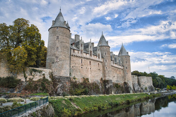 Fototapeta na wymiar Castle of Rohan on the banks of Oust, part of canal Nantes at Brest, at Josselin, a commune in the Morbihan department in Brittany in north-western France