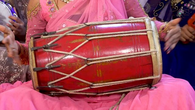 playing a dholak instrument girl, indian drums dholak, Women playing Indian musical instrument dholak, woman playing dhol, dholak, dholki, drum during festival