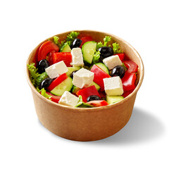 Paper bowl of greek salad with fresh vegetables, feta cheese and black olives isolated on white