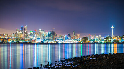 seattle cityskyline at night with reflection on water.