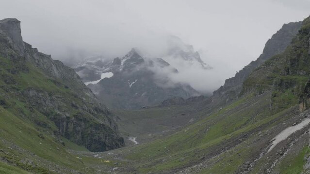 Aerial view of Hamta Pass corridor between valleys of Himachal Pradesh, India on foggy day