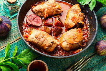 Appetizing meat fried with figs