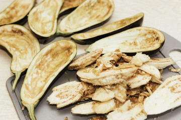 Eggplant cut without pulp on a white table before cooking.
