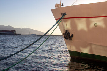 Anchored ship , ship waiting in port in port , background mountain . © photo_mastery