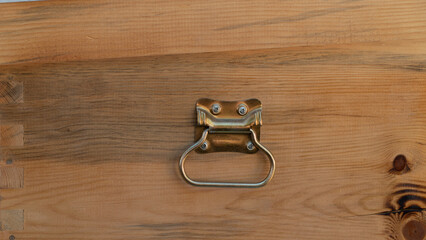 Wooden background with metal handle