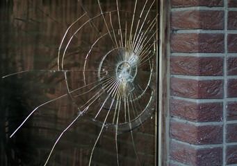 cracked glass with hole