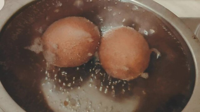 Boiled eggs in metal pan close up. 