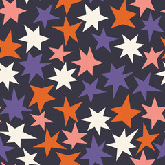 Seamless pattern of random hand drawn colorful stars on black dark background. Creative childish doodle flat illustration for prints, fabric, textile, home, nursery, wallpaper, packaging, decoration.