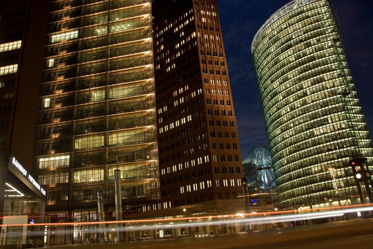 Modern buildings illuminated at night in Potsdamer Platz in the city of Berlin in Germany