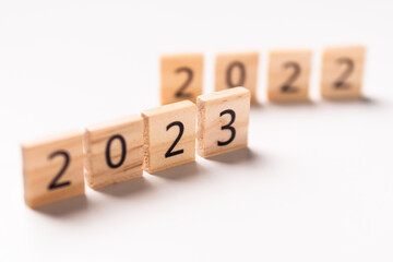 2022 to 2023 text on wooden blocks with copy space for concept background. Resolution, plan, review, goal, start, end year and New Year holiday concepts