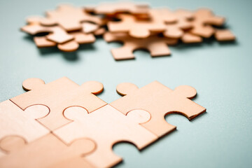 Wooden puzzles jigsaw solving problems in business. Innovation and teamwork in the company with copy space.