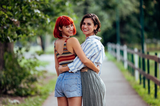 Two Pretty Lesbian Girls, Being Outdoor, Holding Each Other By T