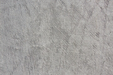 The background of the gray wall, stucco rough surface. Top view. Backgrount or texture for design