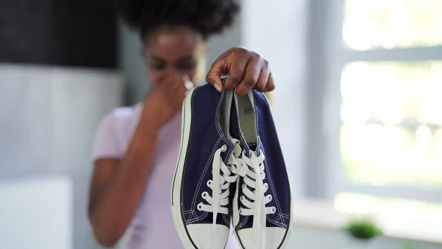 Close-up Of A Young Woman Holding Stinky
