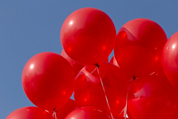 close up of bunch of red balloons