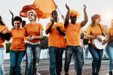 Group of football fans walking to stadium for watching soccer game - Sport entertainment concept