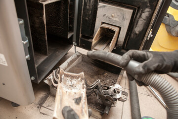 Used pellets in the form of ash, cleaning of an ecological pellet stove