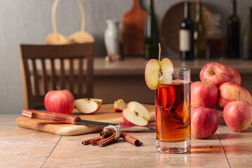 Glass of apple juice and fresh apples.