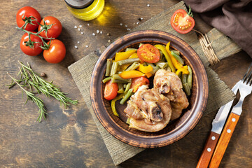 Homemade Thanksgiving dinner baked turkey and vegetables  on a dark wooden table. View from above. Copy space.