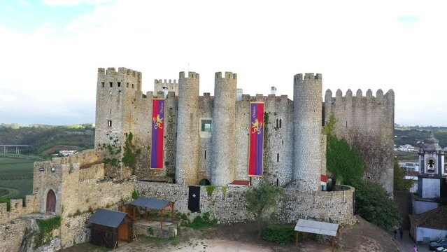 Aerial Pullback of the Historic Medieval Castle in Obidos, Portugal.