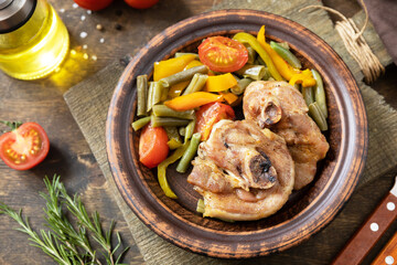 Homemade Thanksgiving dinner baked turkey and vegetables  on a dark wooden table.