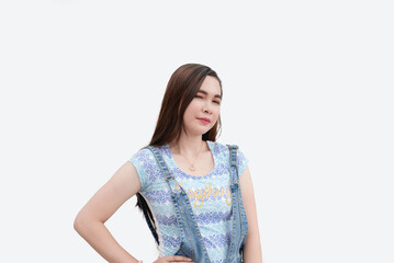 A good-looking Asian woman winks in a flirty way as she poses for the camera with her hands on her hips. Isolated white background studio shot.